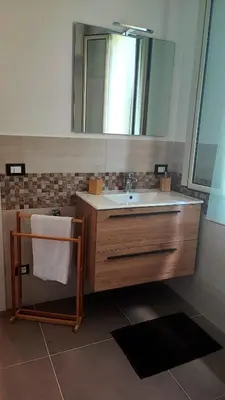 a bathroom with a sink and a mirror at Heaven House Sicily in Carini
