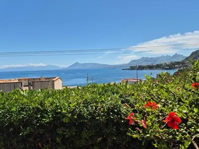 a view of the water and flowers at Villa del Faro, Capo Zafferano in Santa Flavia