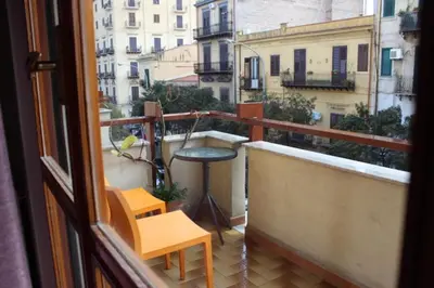 a view of a balcony with a table and chairs at Dante091 in Palermo