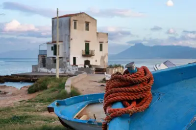 a blue boat with an orange rope on it at VFH Blue Breeze holiday home in Porticello