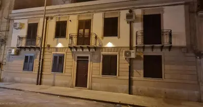 a building with two balconies on the side of it at Sichilia House in Palermo