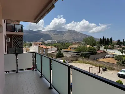 a balcony with a view of the mountains at Castelforte House in Palermo