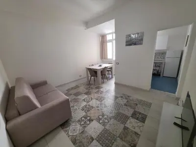 a living room with a couch and a table at Vivaldi Holidays Historic house in the center of Palermo in Palermo