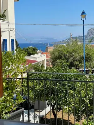 a balcony with a view of a city at Casa Totino Mondello in Palermo