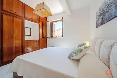 a living room with a couch and a window at Delizioso Appartamento in villa & Piscina Privata in Trabia