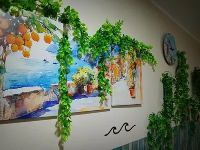 a bunch of plants hanging on a wall at A meravigghia casa vacanze in Bagheria