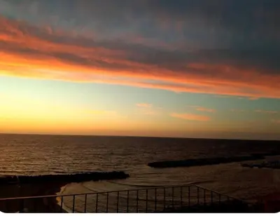 a view of the ocean at sunset at Villa Adele in Trappeto