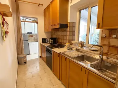 a kitchen with a sink and a stove top oven at Il Vialetto in Mondello
