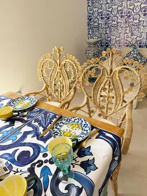 a dining room with a table with blue and white plates at Opera Dolce in Carini