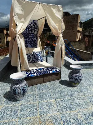 a gazebo with two blue and white vases at Opera Dolce in Carini