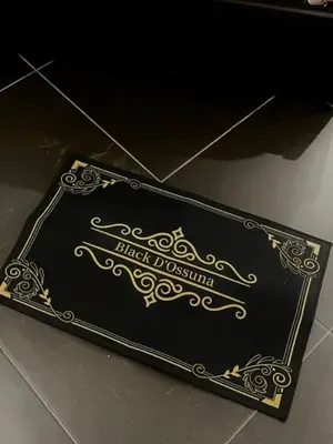 a black box with gold writing on a table at black d'ossuna in Palermo