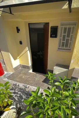 a door to a house with a stairway at black d'ossuna in Palermo