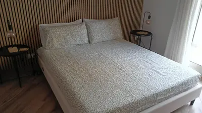 a bed with white sheets and pillows in a bedroom at Sweetpalermo in Palermo