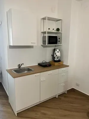 a kitchen with a sink and a microwave at Sweetpalermo in Palermo