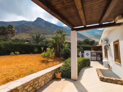 a porch of a house with a view of the mountains at Villa Betta Cuntrariusa con piscina privata e jacuzzi a Scopello in Castellammare del Golfo