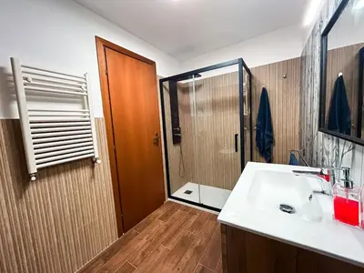 a bathroom with a sink and a shower at Villa Betta Cuntrariusa con piscina privata e jacuzzi a Scopello in Castellammare del Golfo