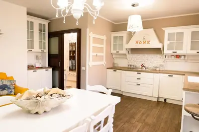 a kitchen with white cabinets and a white counter top at Appartamento centrale 2 camere a Termini Imerese - Marconi House in Termini Imerese