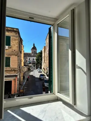 a window with a view of a city street at Dimora Al-Noor in Palermo