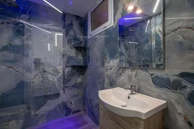 a bathroom with a sink and a mirror at Santerasmo rooms Charm in Palermo