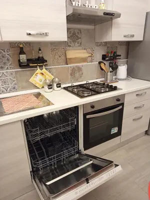 a kitchen with an oven with its door open at Chez D'Ossuna con Patio Privato - centro storico Cattedrale - ampio 6 ospiti in Palermo