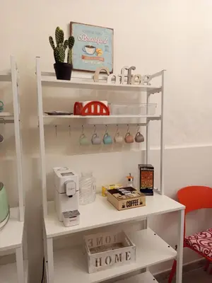 a room with a shelf with a home office at Chez D'Ossuna con Patio Privato - centro storico Cattedrale - ampio 6 ospiti in Palermo