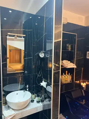 a bathroom with a sink and a mirror at Armonia Serenity Room Politeama in Palermo