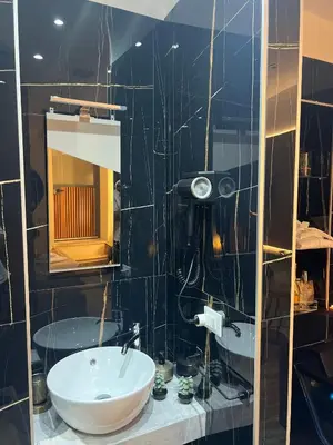 a bathroom with a sink and a mirror at Armonia Serenity Room Politeama in Palermo