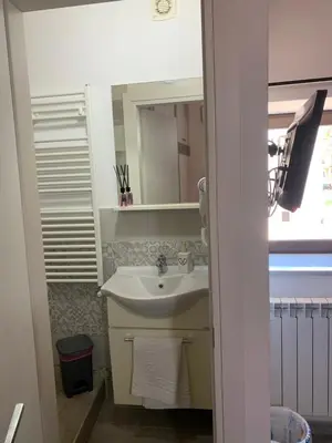 a bathroom with a sink and a mirror at U muragliuni 2 in Lascari