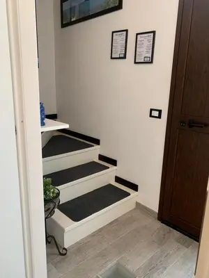 an open door into a room with a hallway at U muragliuni 2 in Lascari