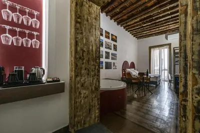 a hallway with a kitchen and a dining room at Ballarooms Experience in Palermo