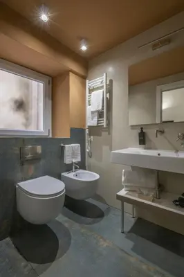 a bathroom with a toilet and a sink at Ballarooms Experience in Palermo
