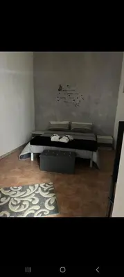 a room with a bed and a rug on the floor at Casa Passamonte in Palermo