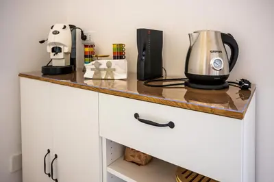 a kitchen counter with a coffee maker on it at Palermo Centro Le Cupole della Felicissima in Palermo