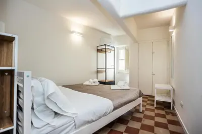 a white bedroom with a bed in a room at Palermo Centro Le Cupole della Felicissima in Palermo