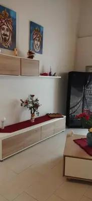 a living room with two beds and a tv at LA CASA DI ALISIA Palermo Centro in Palermo