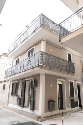 a building with a balcony on top of it at ESSE Homes Sant Elia in Santa Flavia