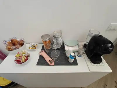 a counter top with a coffee maker and some food at Villa Mare Luna in Balestrate