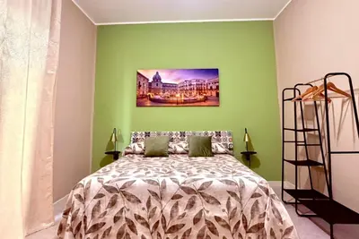 a living room with a couch and a yellow table at Victoria Apartment in Palermo