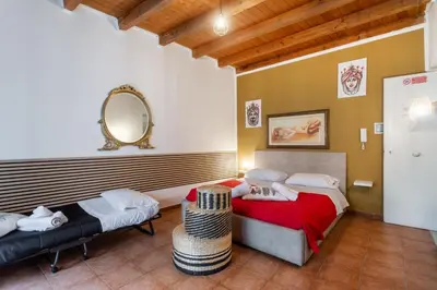 a bathroom with a sink and a toilet and a window at Paradise Rooms B&B in Palermo
