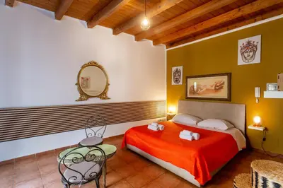 a bedroom with a bunk bed and a glass table at Paradise Rooms B&B in Palermo