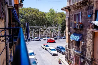 an empty road next to a body of water at Porta Reale RooM in Palermo