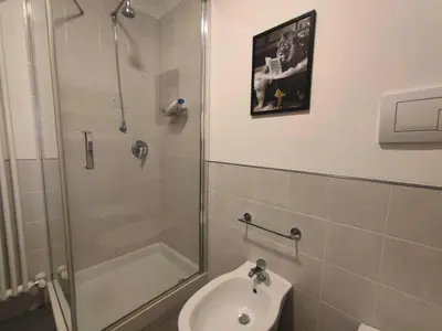 a bathroom with a shower and a toilet and a sink at Il rifugio del Capo in Palermo