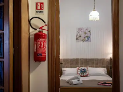 a fire hydrant is hanging on the wall of a room at Casa Melina in Palermo