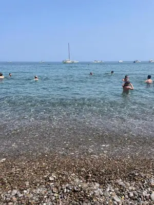 a group of people swimming in the water at Ombelico di VenereVilla in Mandra Capreria