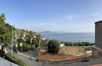 a view of the ocean from a building at Ombelico di VenereVilla in Mandra Capreria