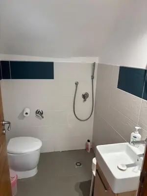 a bathroom with a shower and a toilet and a sink at Villa Grasta, Nuova Esclusiva con Piscina in Capaci