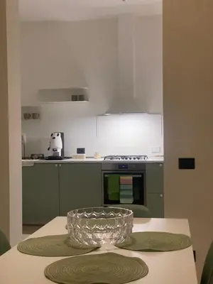 a glass bowl sitting on a table in a kitchen at Ma Home in Cinisi