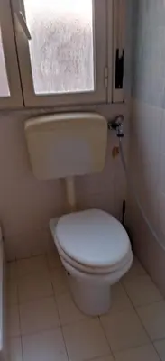 a bathroom with a white toilet with a window at A 2 passi dal Politeama in Palermo