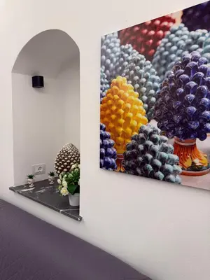 a wall with two paintings of fruit on it at VUCCIRIA' S ROOM centro storico in Palermo