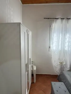 a white room with a window and a curtain at Casa la Fenice in Palermo